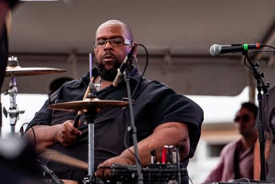 Revelation: A Celebration of the MPLS Sound performing on an outdoor stage.