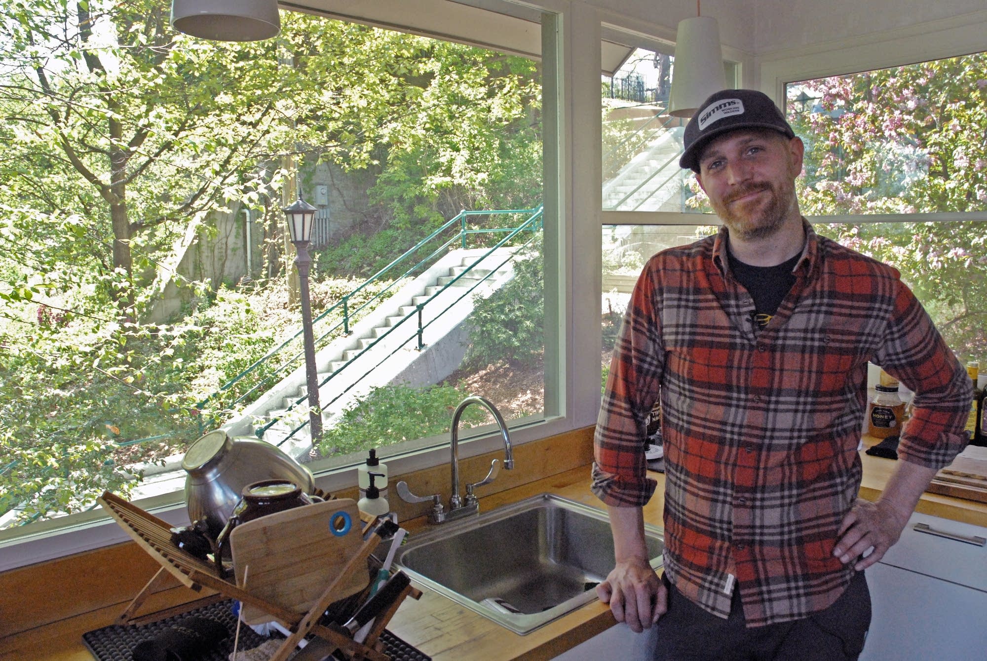 Joe Alton's kitchen looks out over the only access to his hillside home.