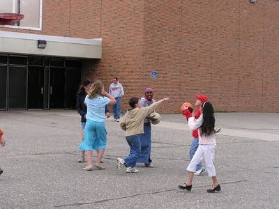 Kids play basketball
