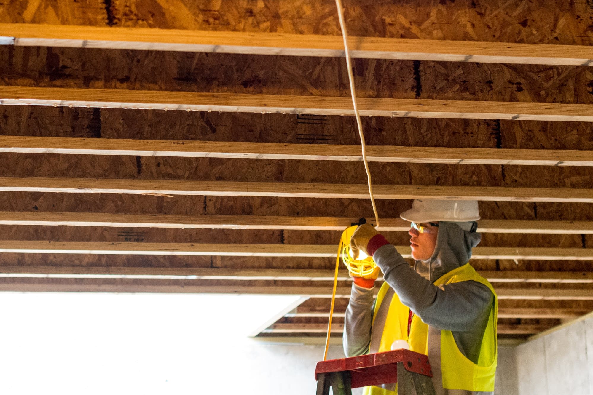 Luke Jeska, 18, a high school student, rigs up a safety light.