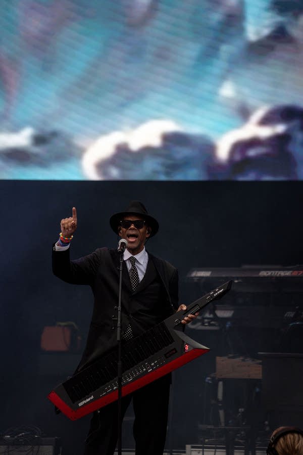 Jimmy Jam and Terry Lewis perform on an outdoor stage.