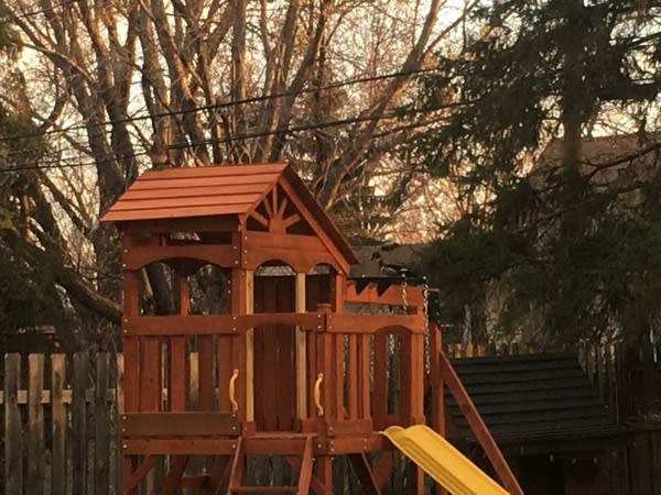 A duck sits on top of a playset