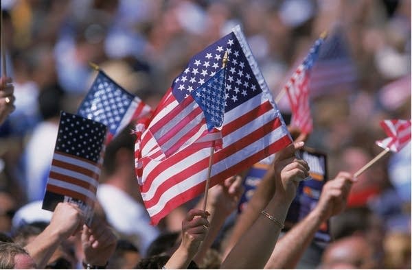 22 Sep 2001:  American Flags are waved by the crowd during the game between the Ohio State Buckeyes and the California Los Angeles (UCLA) Bruins at the Rose Bowl in Pasadena, California. The Bruins defeated the Buckeyes 13-6.Mandatory Credit: Stephen Dunn  /Allsport