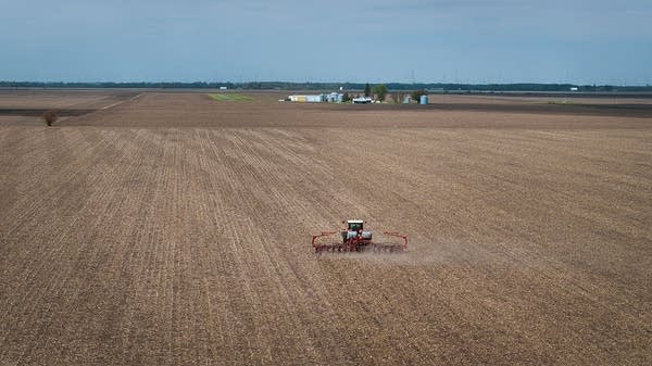 A tractor planting soybeans near Dwight, Illinois. 