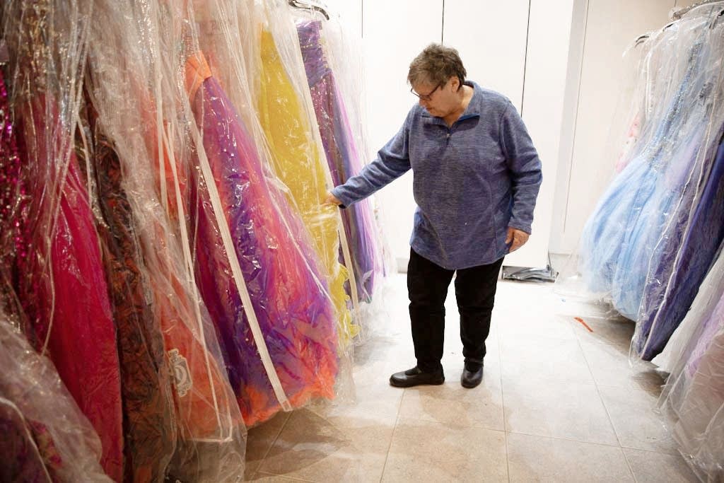 Pam Philipp looks through prom dresses.
