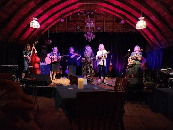 A six-piece string band performing onstage