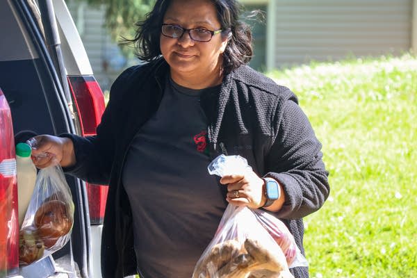 A person holding groceries 