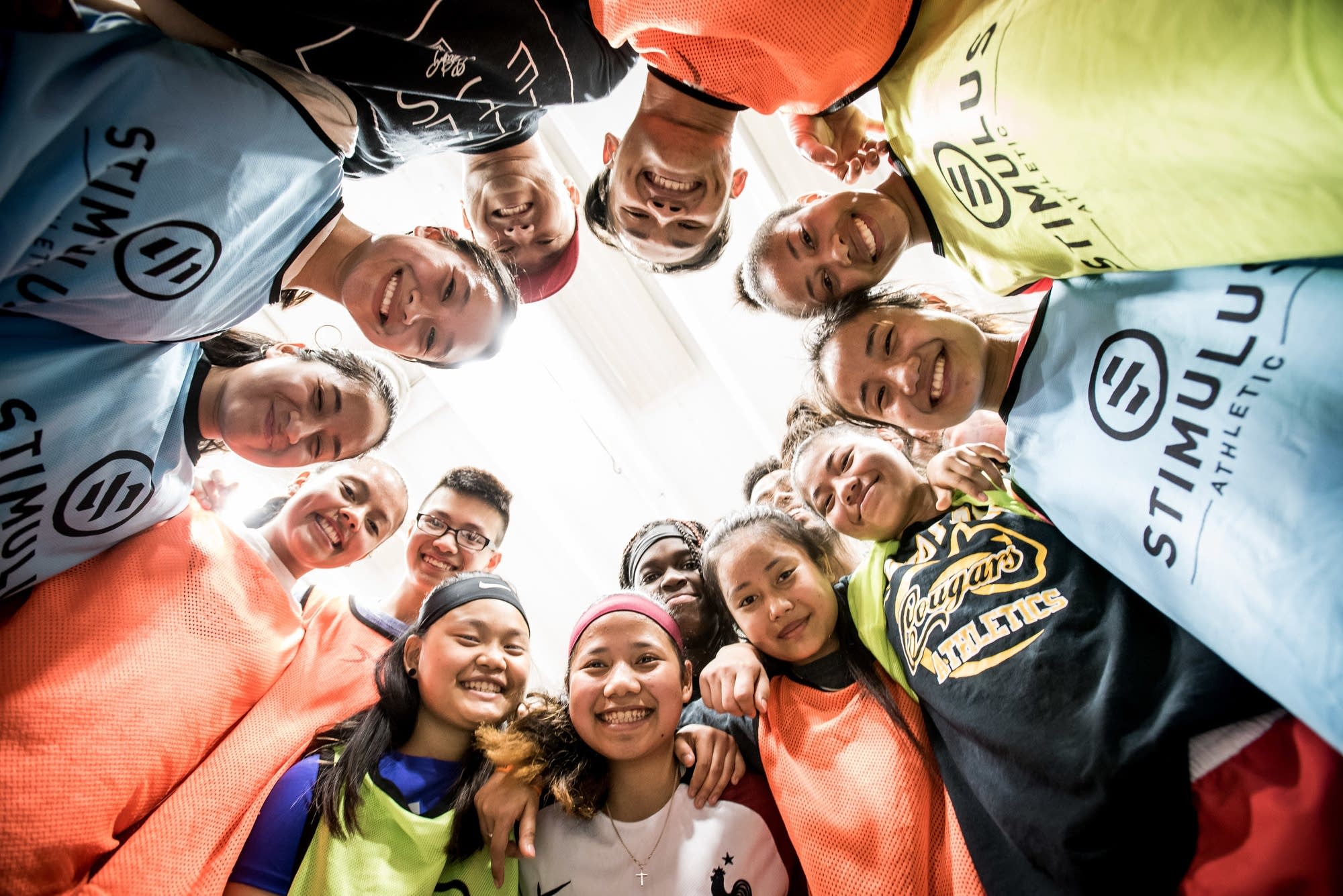 Like A Girl team members huddle for a portrait during practice.