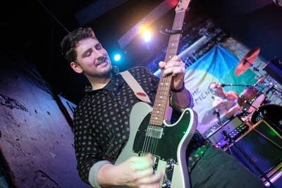 Two musicians performing onstage