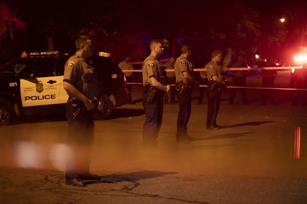 Police guard the scene.