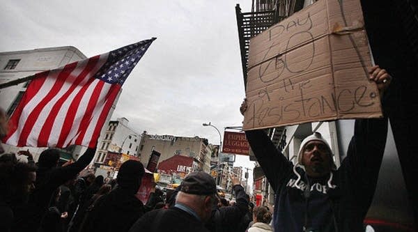 Occupy Wall Street activists march in downtown Manhattan after police removed the protesters early in the morning from Zuccotti Park on November 15, 2011 in New York City. 