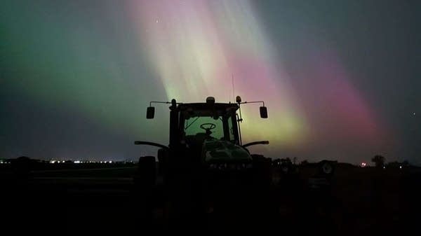 A tractor under the northern lights