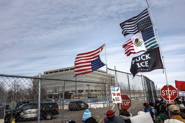 Flags, including American and Mexican flags and a banner