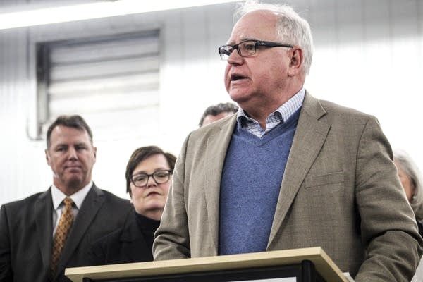 A man standing behind a podium. 