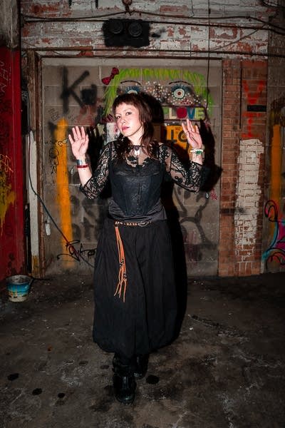 Sophie Hiroko poses for a photo in a garage.