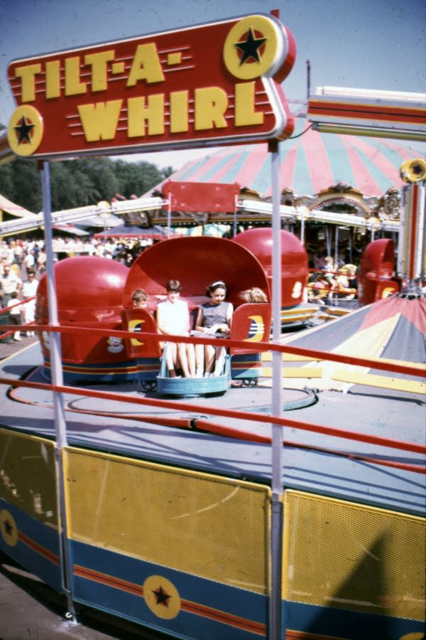 An older photo of the Tilt-A-Whirl fair ride.