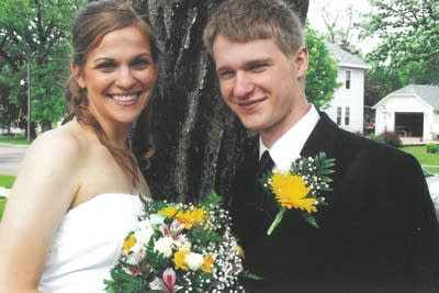 Two people smile for a photo