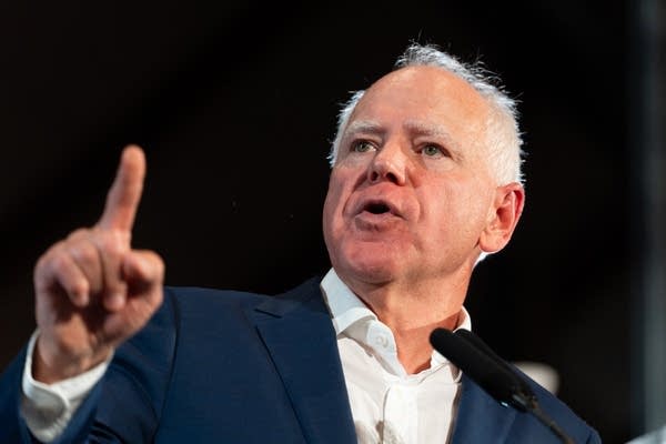 man speaks at a podium