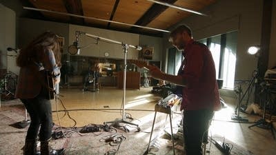 A band performing in a recording studio