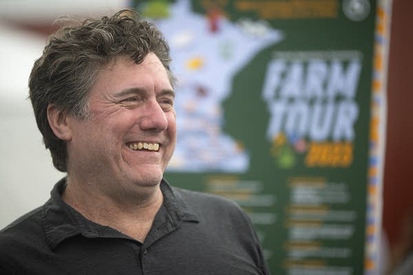 a man smiles and laughs