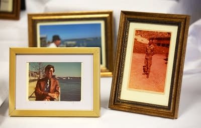 Framed pictures on a table.