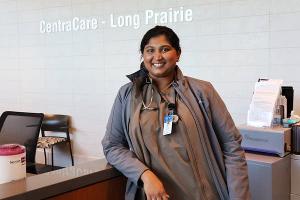 A woman poses in a clinic