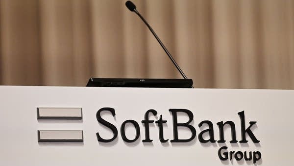 A Softbank Group logo is seen during the company's financial results press conference at a hotel in Tokyo on May 9, 2019. - Japan's SoftBank Group on May 9 reported annual net profit jumped more than a third, helped by gains from its investment fund which has ploughed billions into some of the hottest names in the tech sector.