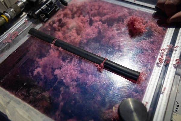 Fabric is torn apart in a machine