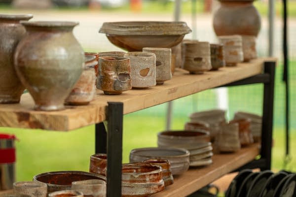 Handmade pottery displayed on shelf