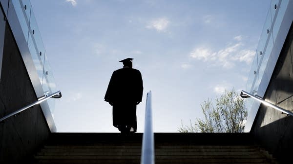 Silhouette of College Graduate Climbing Steps