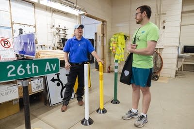 Two people talking  about bollards