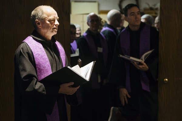 Mayflower choir members wait before service. 