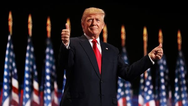 Then-Republican presidential candidate Donald Trump gives two thumbs up to the crowd during the Republican National Convention on July 21, 2016, in Cleveland.