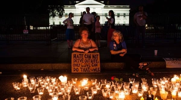 People gather in front of the White House on Sunday in Washington, DC.. for a vigil in response to the death of a counter-protestor in the August 12th 'Unite the Right' rally that turned violent in Charlottesville, Virginia. 