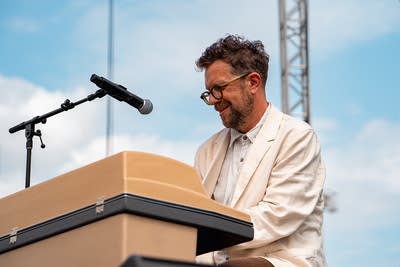 The union and phil cook performing on an outdoor stage