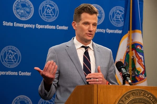 A man speaking at a podium. 