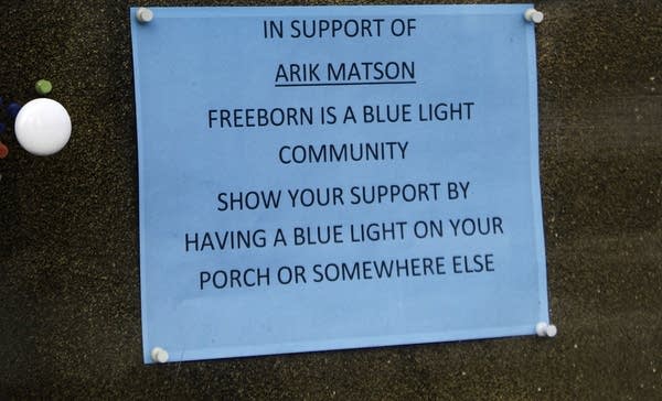 A sign reads In support of Arik Matson Freeborn is a blue light community