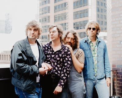 members of the band night moves pose for a photo