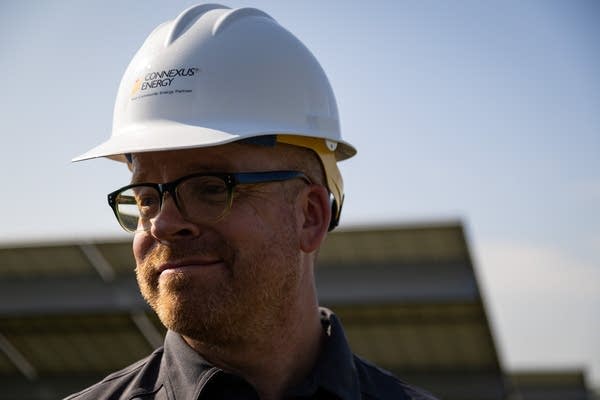 A man wearing a white hardhat