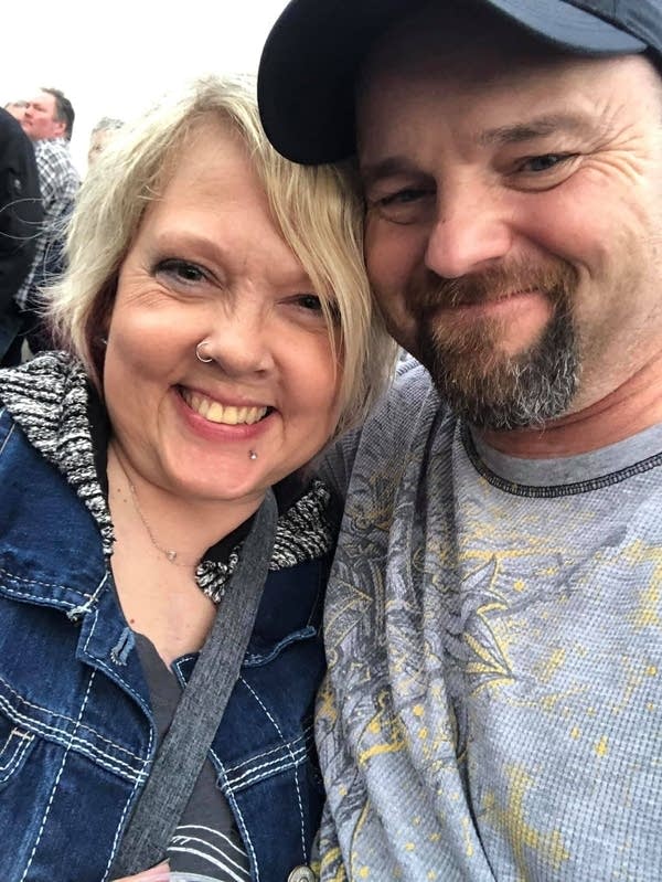 Two people hug together for a photograph.
