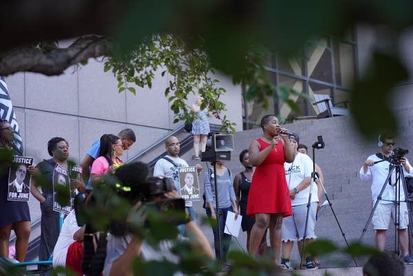 Minneapolis NAACP President Leslie Badu address the crowd.