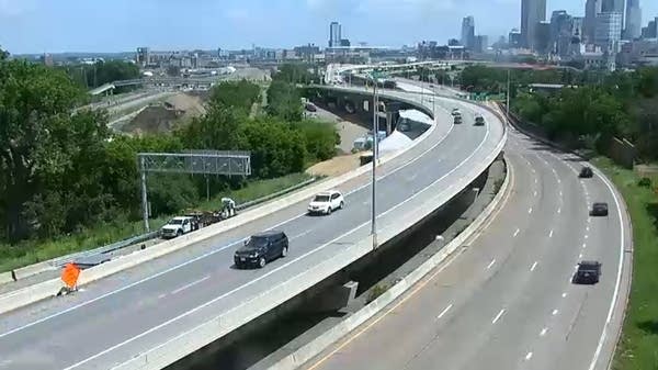 Traffic moves along a freeway in a city