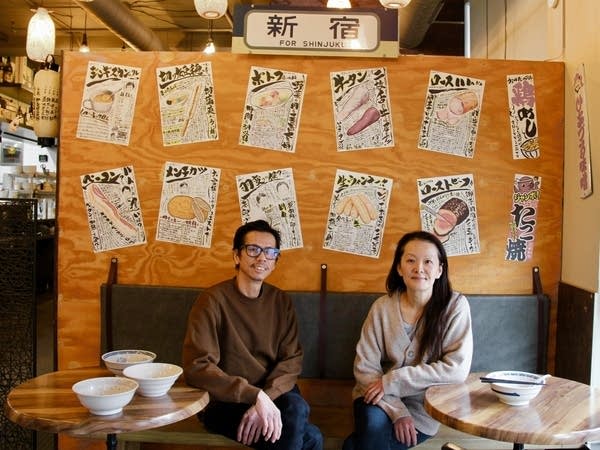 Two people posing indoors for photo2