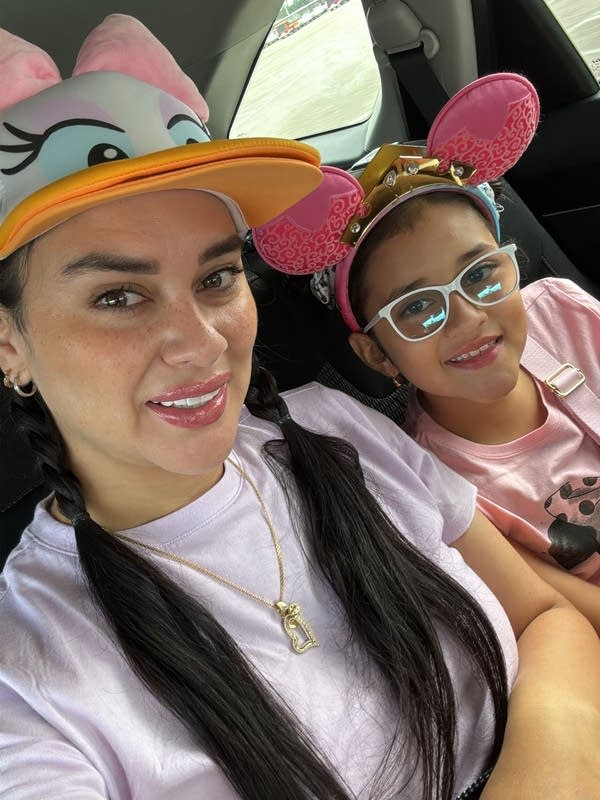 mom and daughter pose for a selfie