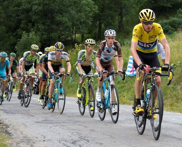 Poster Chris Froome leads the pack in the Tour de France
