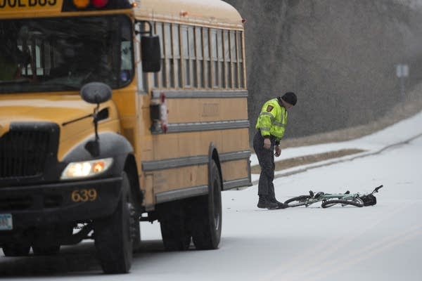 A Minnesota State Trooper investigates a scene.