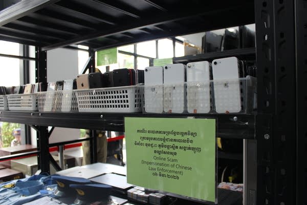 Cell phones in baskets on shelves