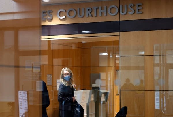 SAN JOSE, CALIFORNIA - NOVEMBER 17: Theranos founder and former CEO Elizabeth Holmes goes through a security checkpoint as she arrives for her trial at the Robert F. Peckham Federal Building on November 17, 2021 in San Jose, California. Holmes is facing charges of conspiracy and wire fraud for allegedly engaging in a multimillion-dollar scheme to defraud investors with the Theranos blood testing lab services.