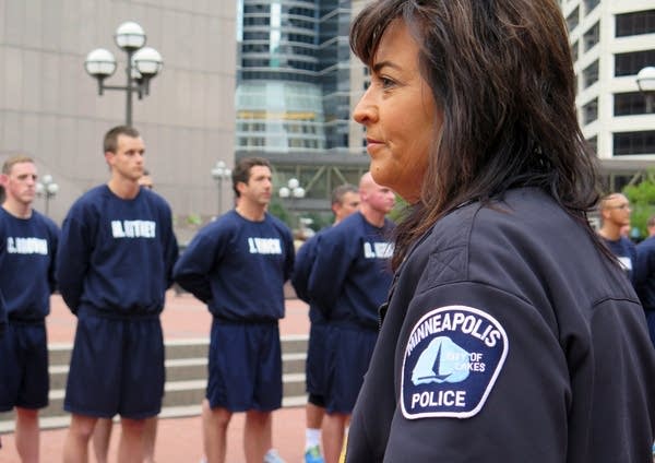 Minneapolis police chief Janee Harteau watched.