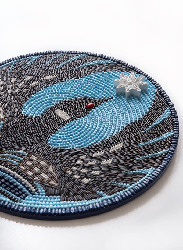 A seed art piece featuring the "Rebel Loon" design.